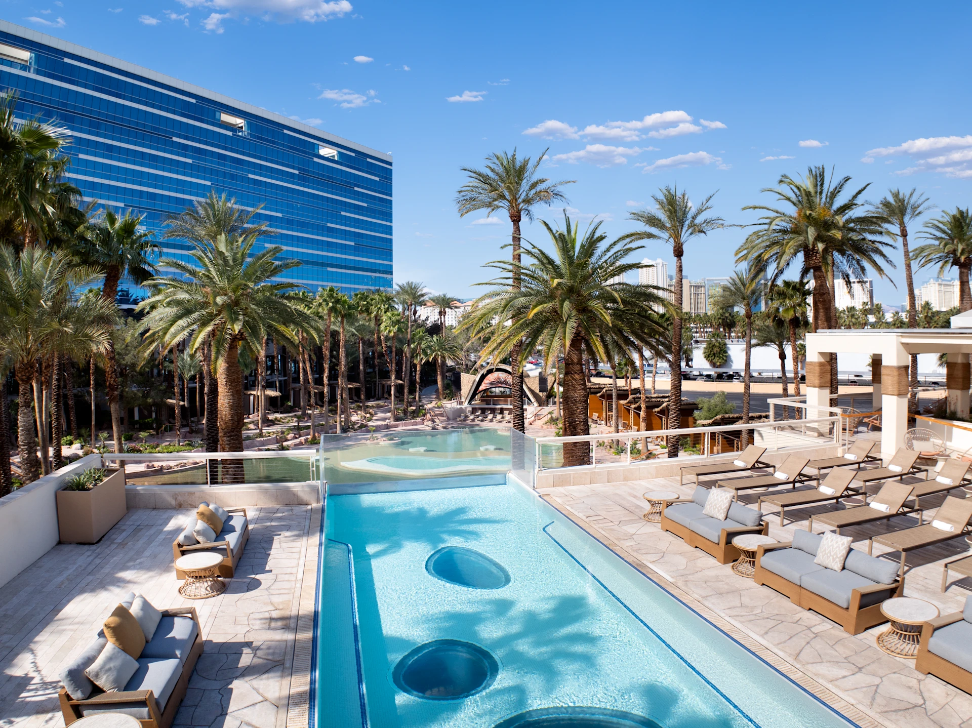 Outdoor pool deck lounge furniture and daybeds at Virgin Hotels Las Vegas